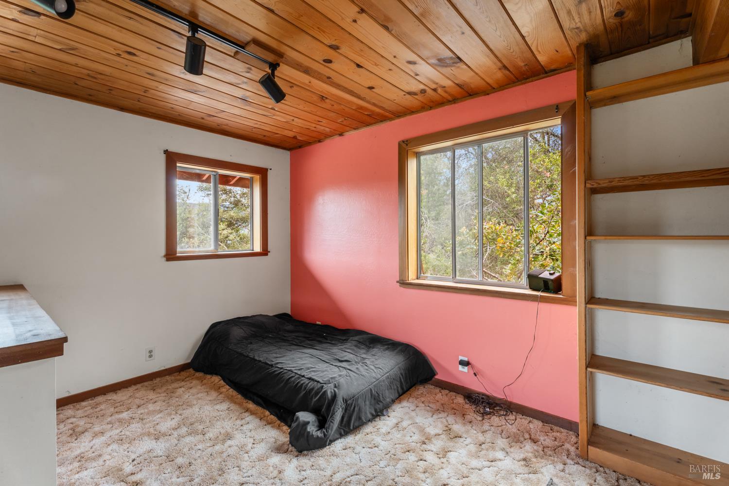 13800 Poonkinney Road Dos Rios, CA 95429 - Photo 18 of 28 a bedroom with a bed and a window