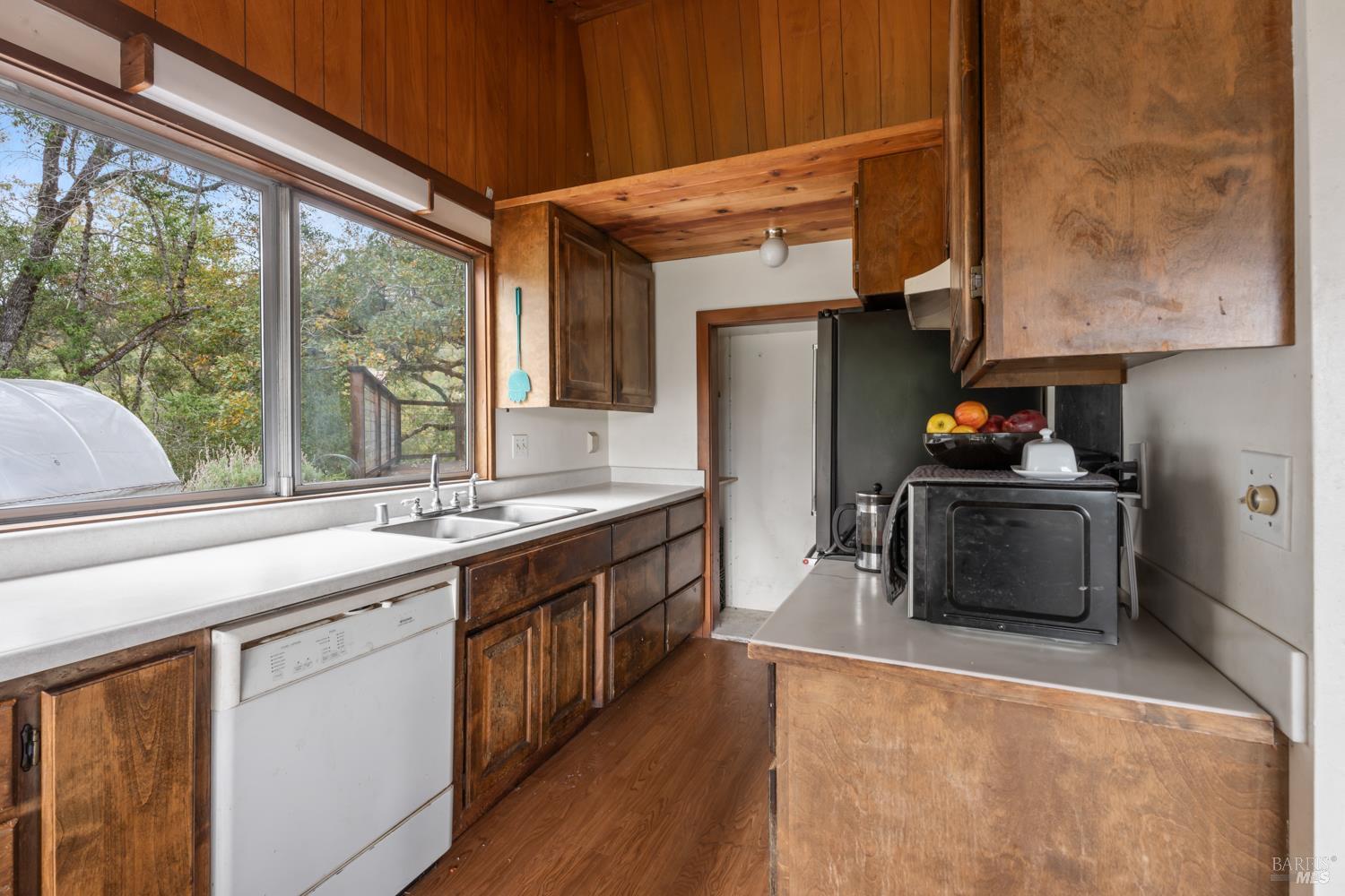 13800 Poonkinney Road Dos Rios, CA 95429 - Photo 20 of 28 a kitchen with stainless steel appliances a stove a sink and a refrigerator