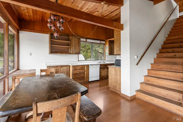 a kitchen with stainless steel appliances granite countertop a sink and cabinets