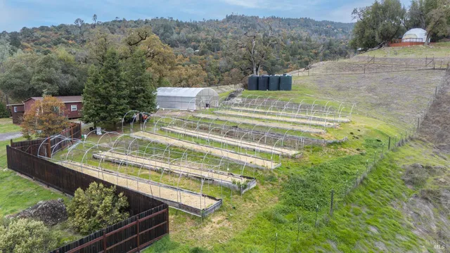 a view of a swimming pool with a yard and mountain view