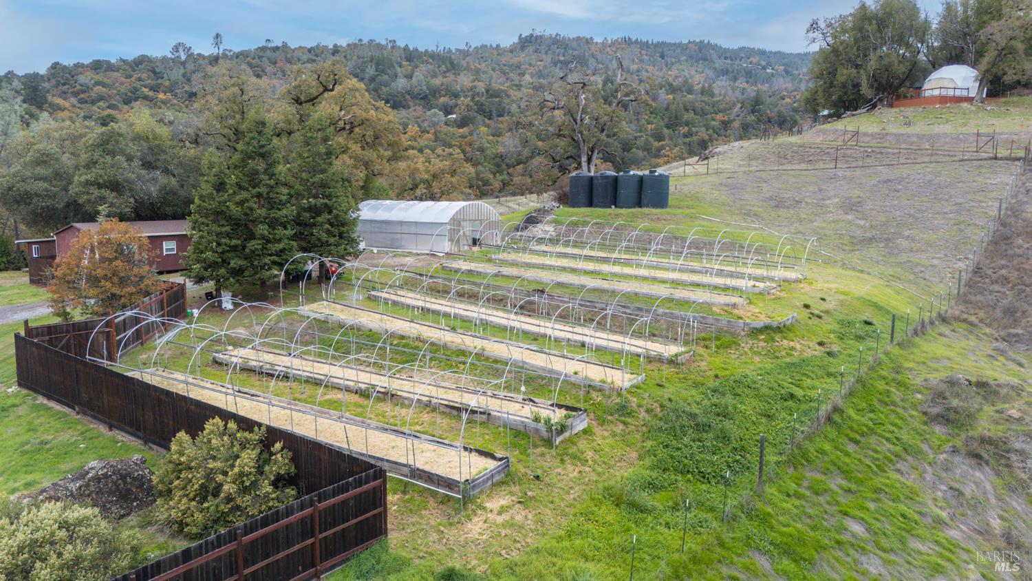 13800 Poonkinney Road Dos Rios, CA 95429 - Photo 3 of 28 a view of a swimming pool with a yard and mountain view