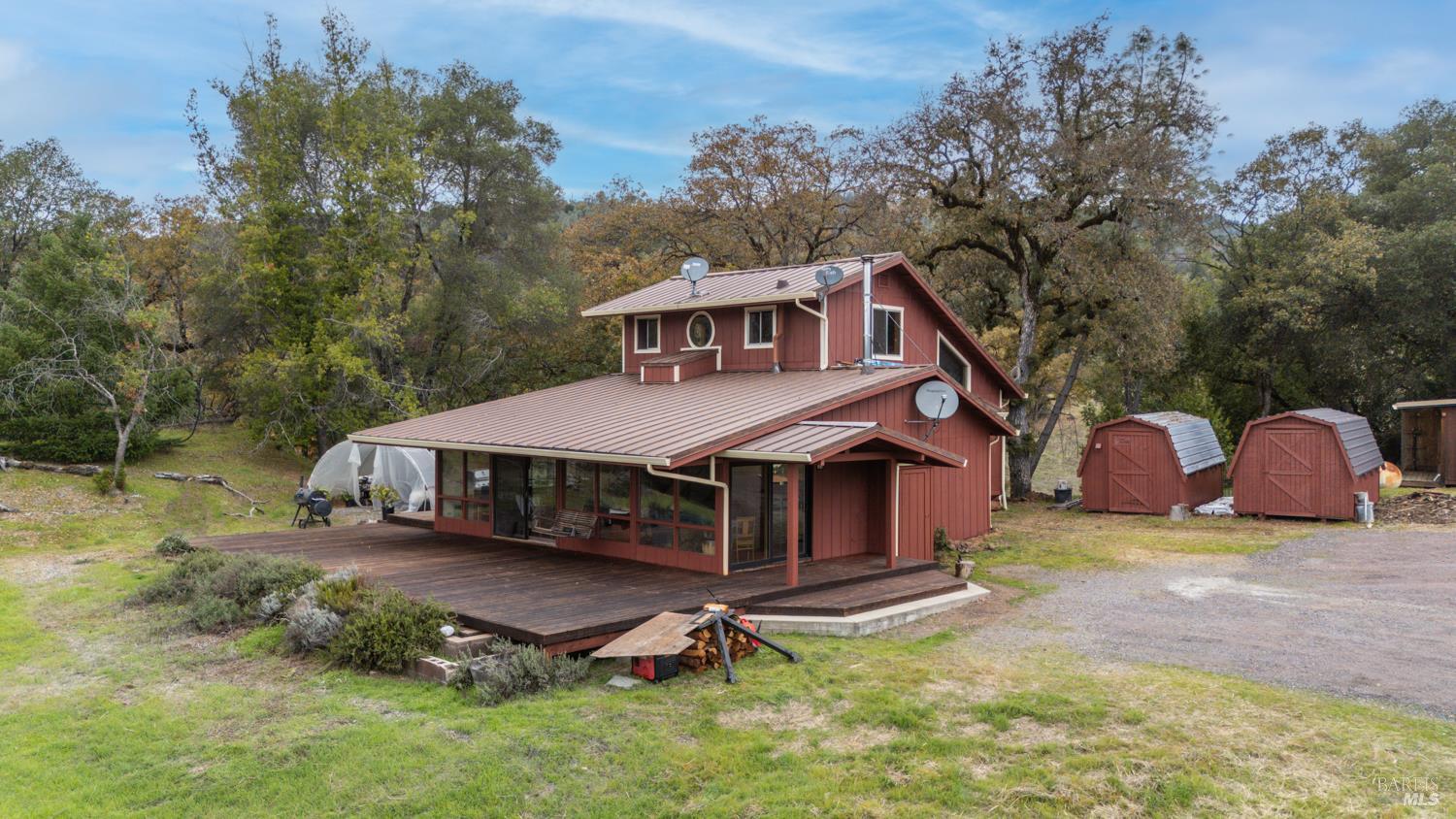 13800 Poonkinney Road Dos Rios, CA 95429 - Photo 6 of 28 a house with trees in the background