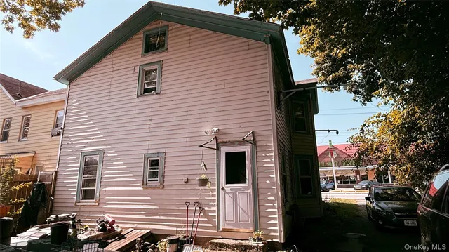 a view of a house with a street