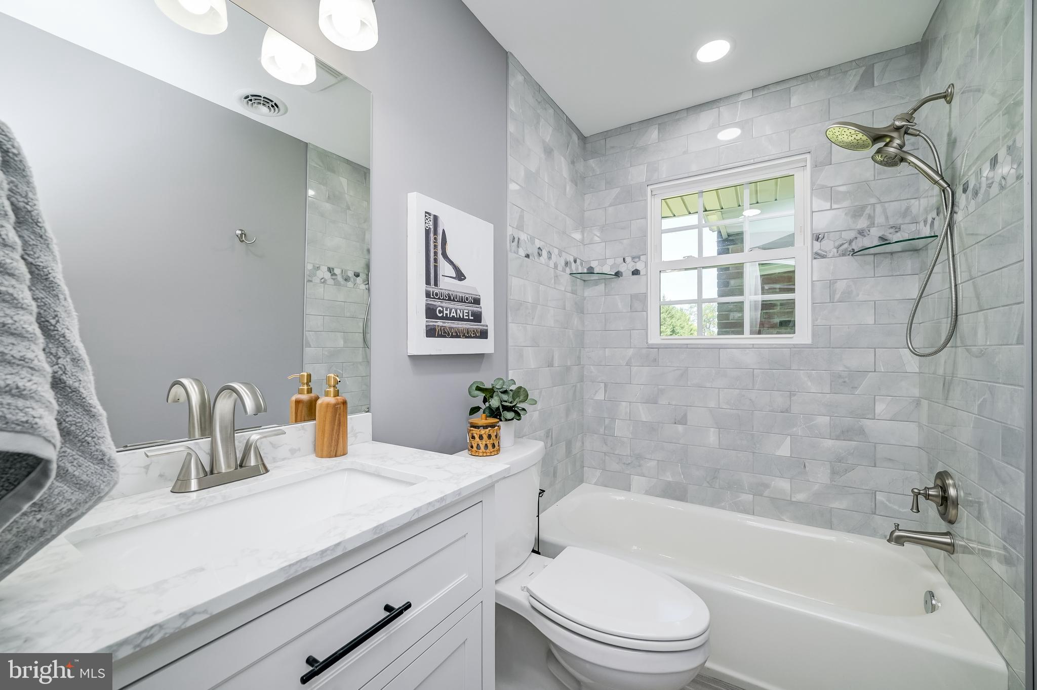21020 Peach Tree Road Dickerson, MD 20842 - Photo 34 of 57 a bathroom with a granite countertop bathtub sink vanity mirror and toilet