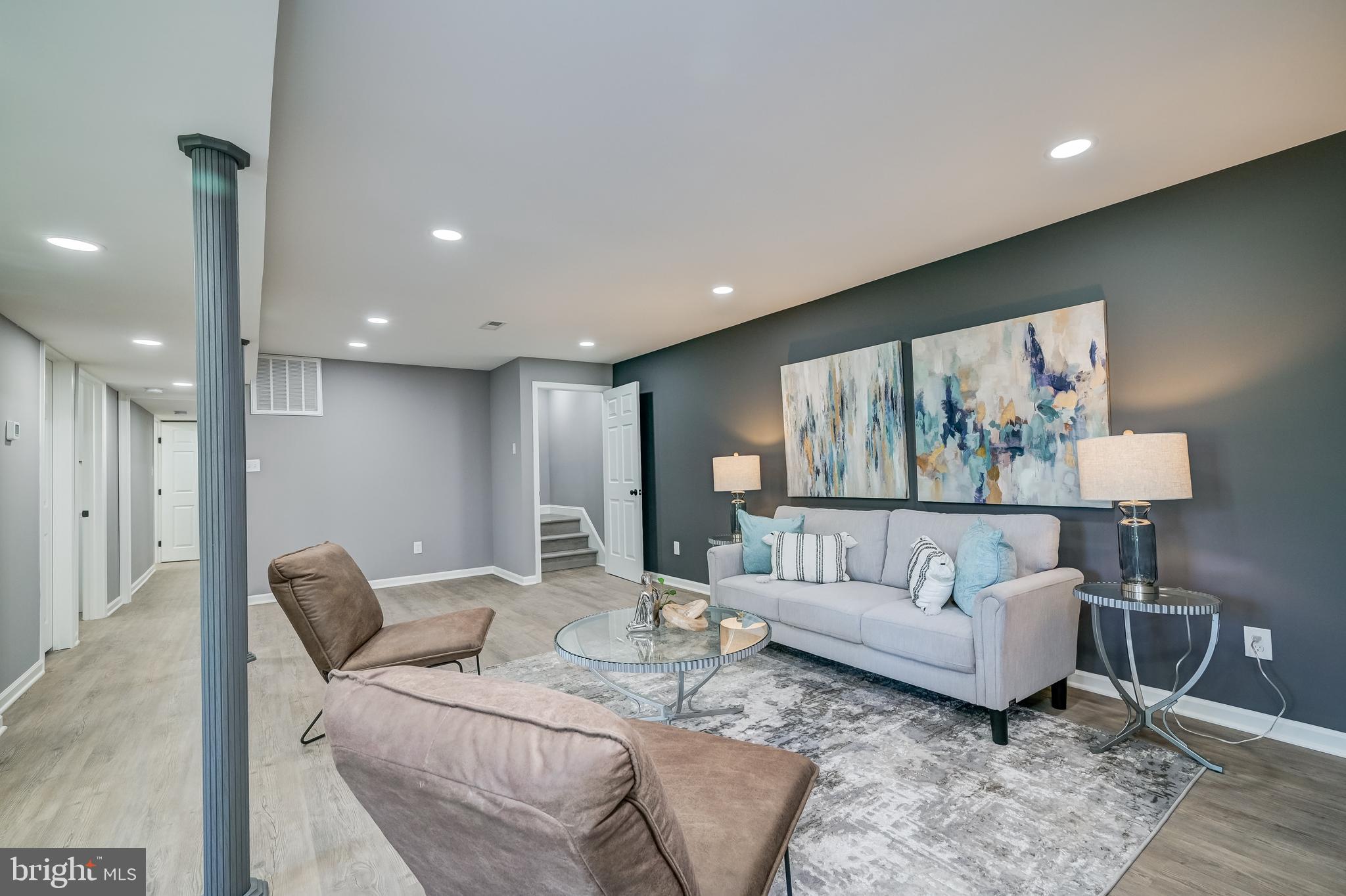 21020 Peach Tree Road Dickerson, MD 20842 - Photo 42 of 57 a living room with furniture and a painting on the wall