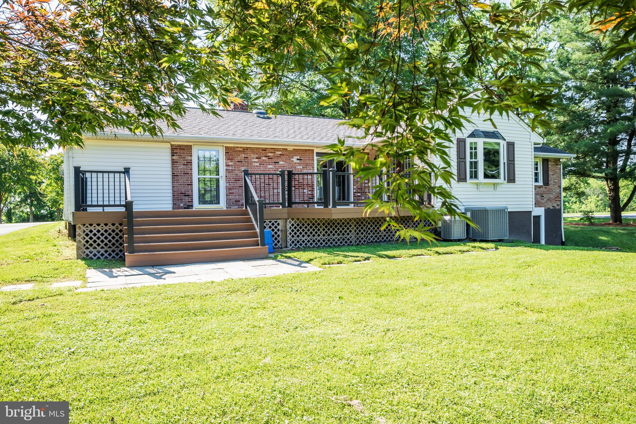 21020 Peach Tree Road Dickerson, MD 20842 - Photo 49 of 57 a front view of a house with a yard and trees
