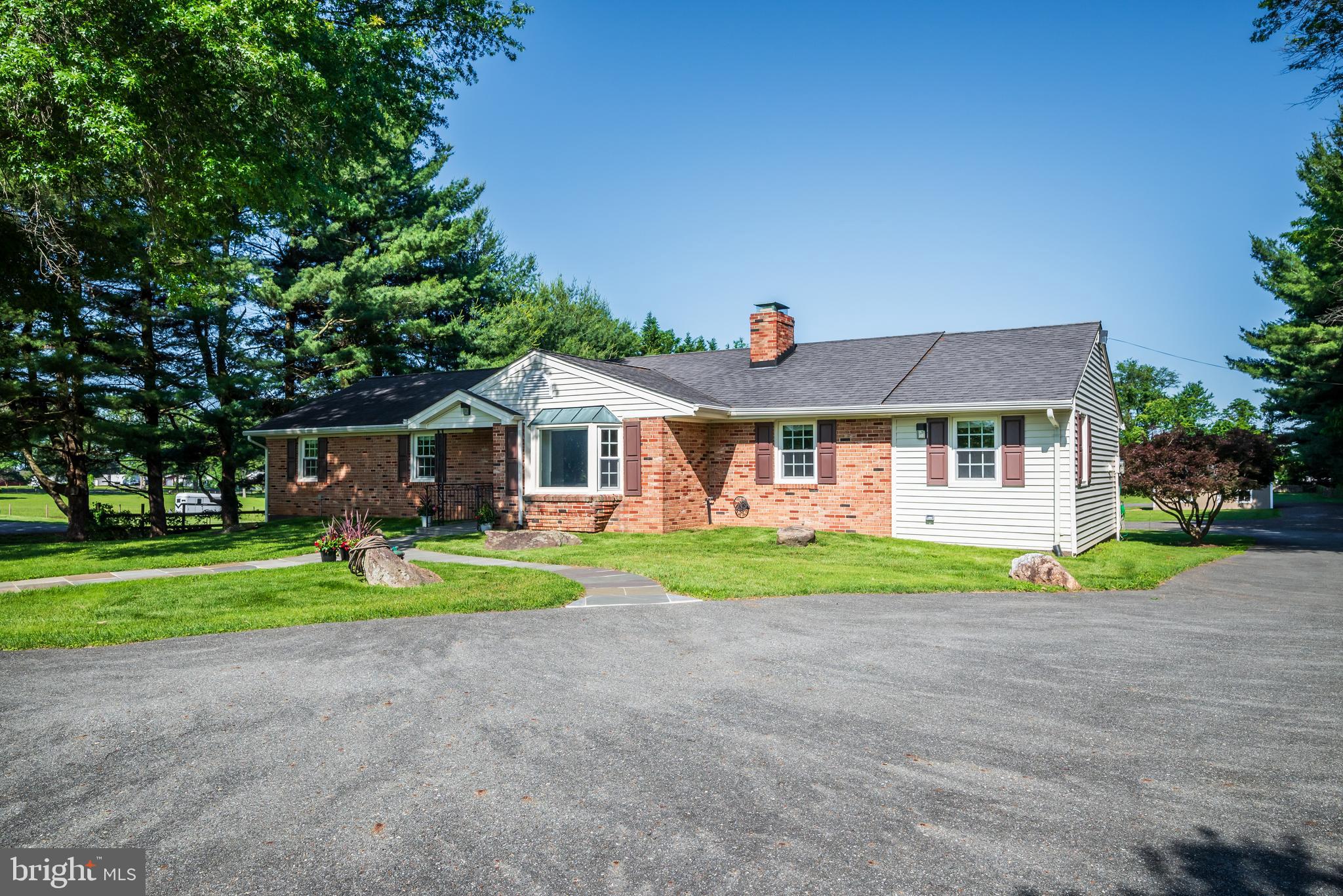 21020 Peach Tree Road Dickerson, MD 20842 - Photo 56 of 57 a front view of a house with a yard and porch