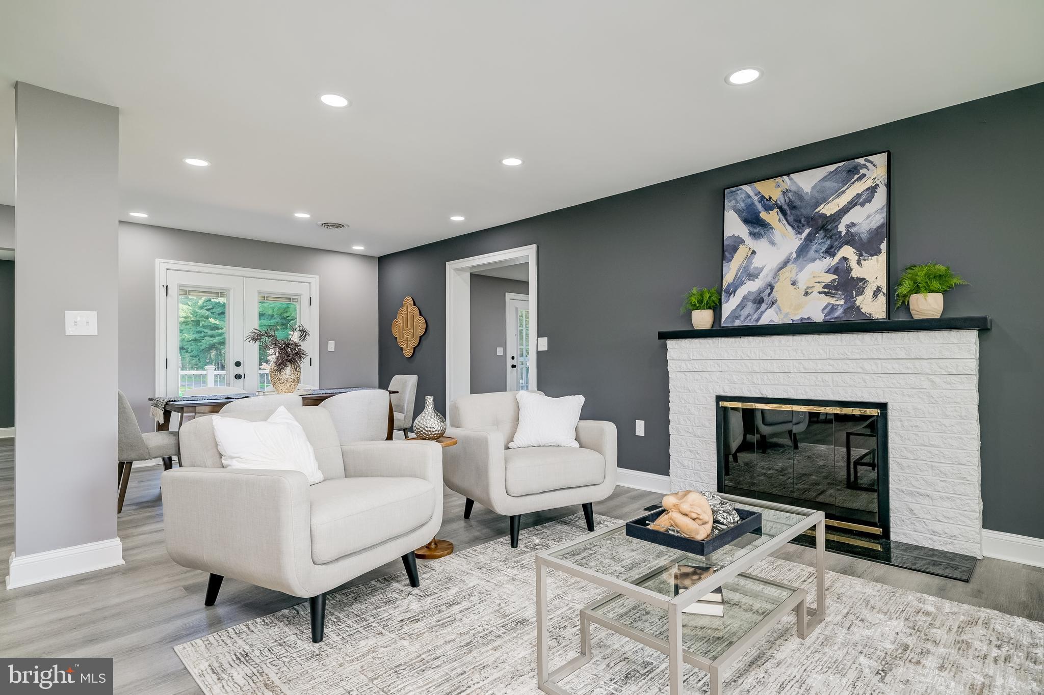 21020 Peach Tree Road Dickerson, MD 20842 - Photo 7 of 57 a living room with furniture and a fireplace