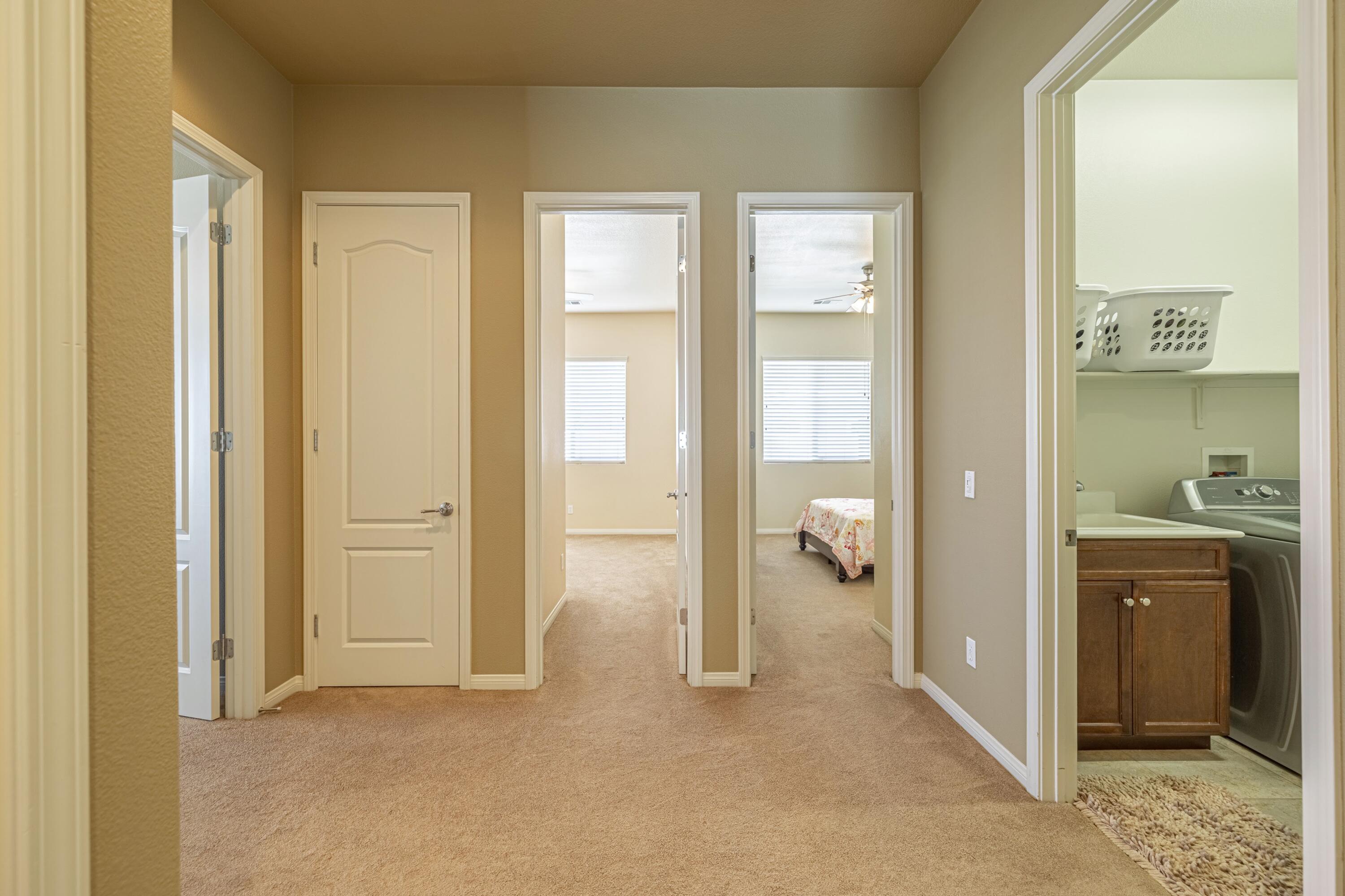 6853 Cabernet Road Palmdale, CA 93551 - Photo 23 of 42 a view of a hallway with bathroom and glass door