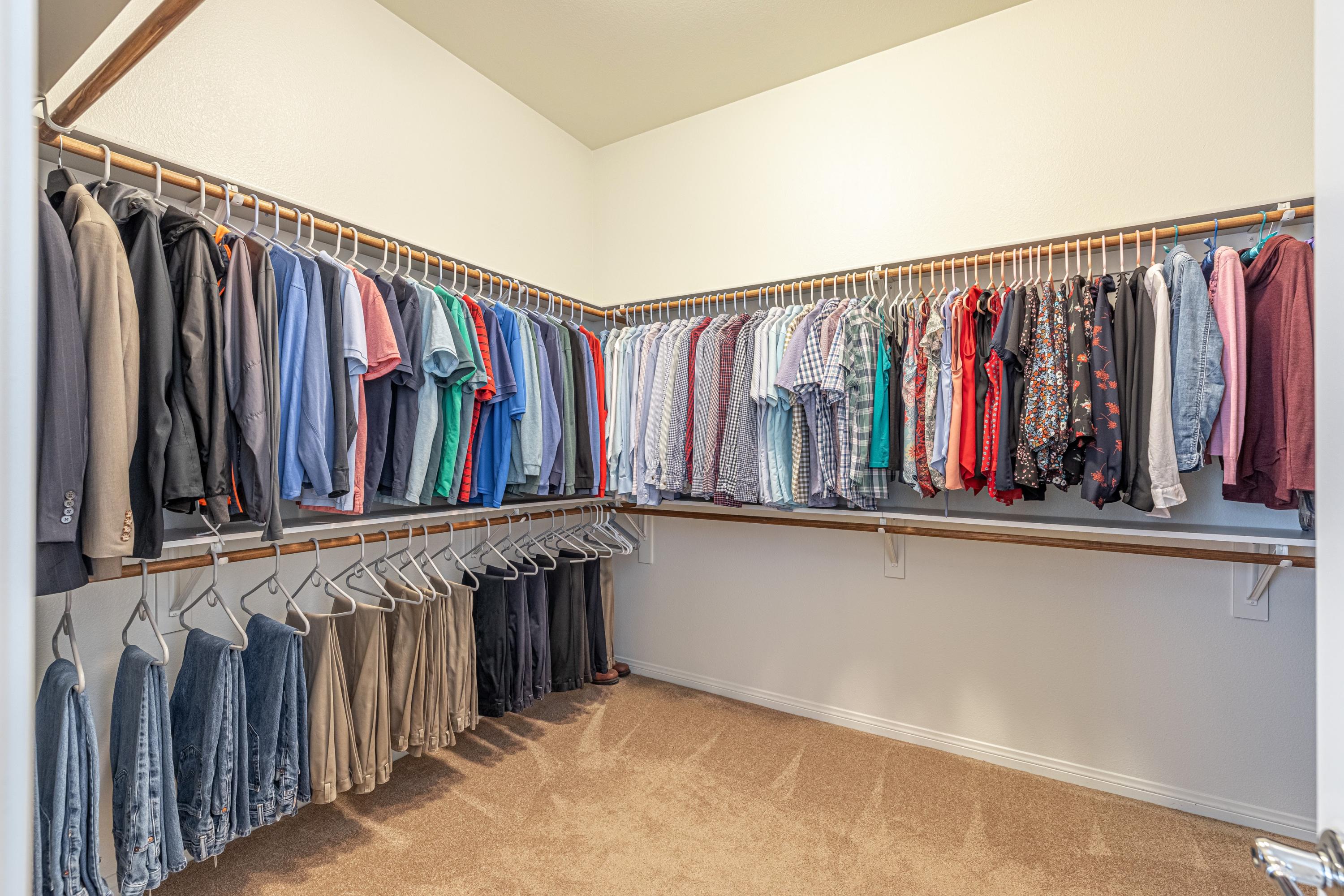 6853 Cabernet Road Palmdale, CA 93551 - Photo 36 of 42 a view of walk in closet with clothes and shoes