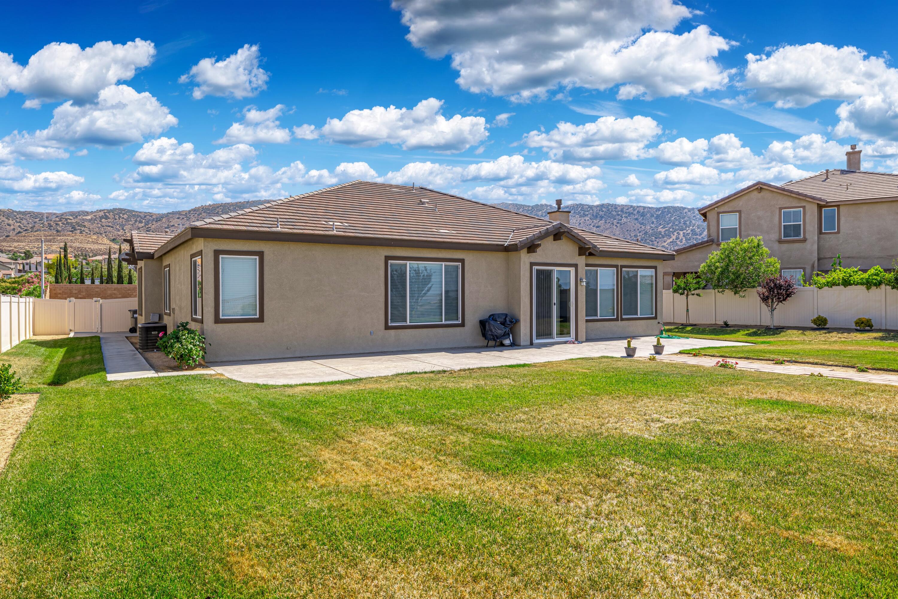 6853 Cabernet Road Palmdale, CA 93551 - Photo 41 of 42 a view of a house with a backyard