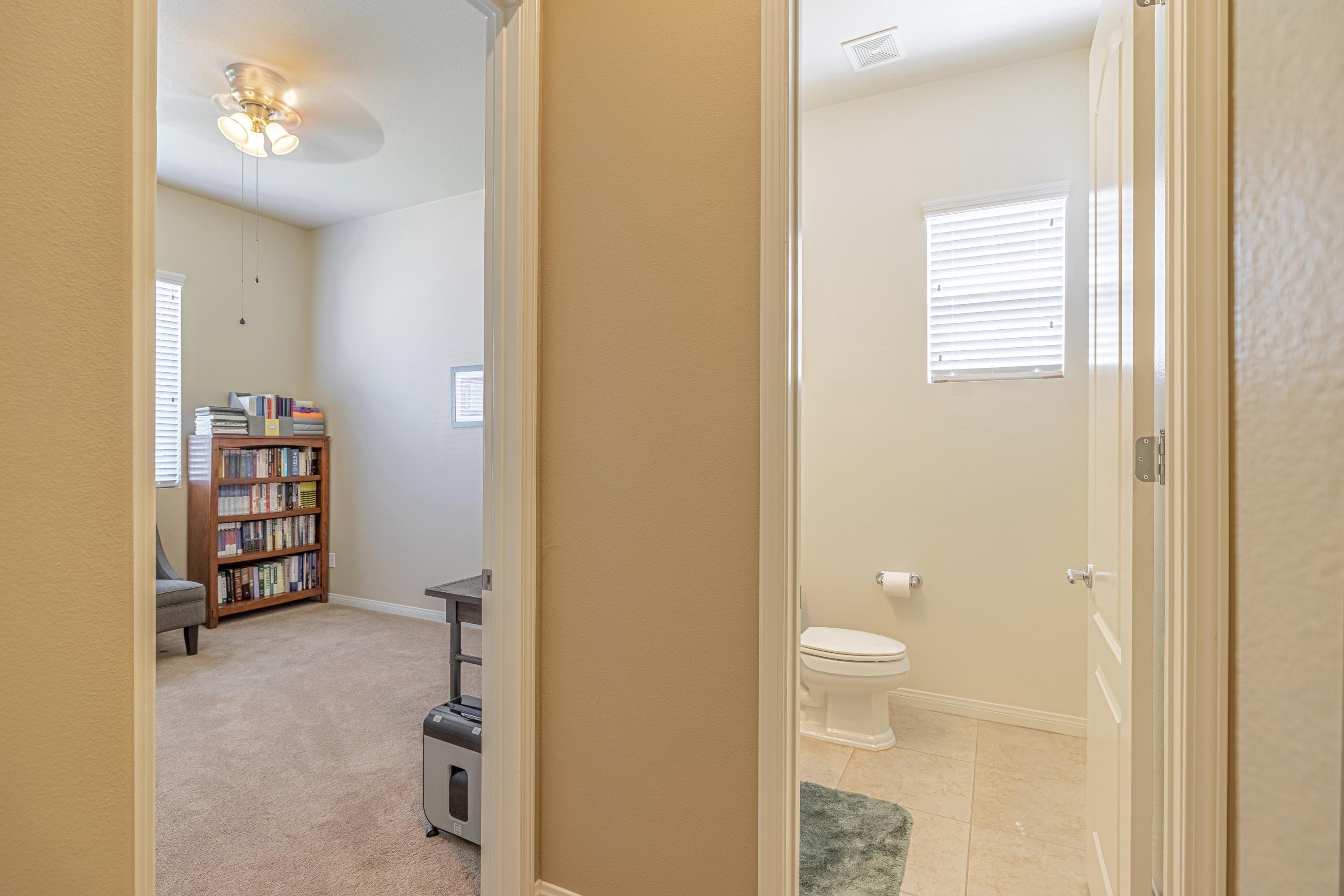 6853 Cabernet Road Palmdale, CA 93551 - Photo 6 of 42 a bathroom with a toilet sink and shower