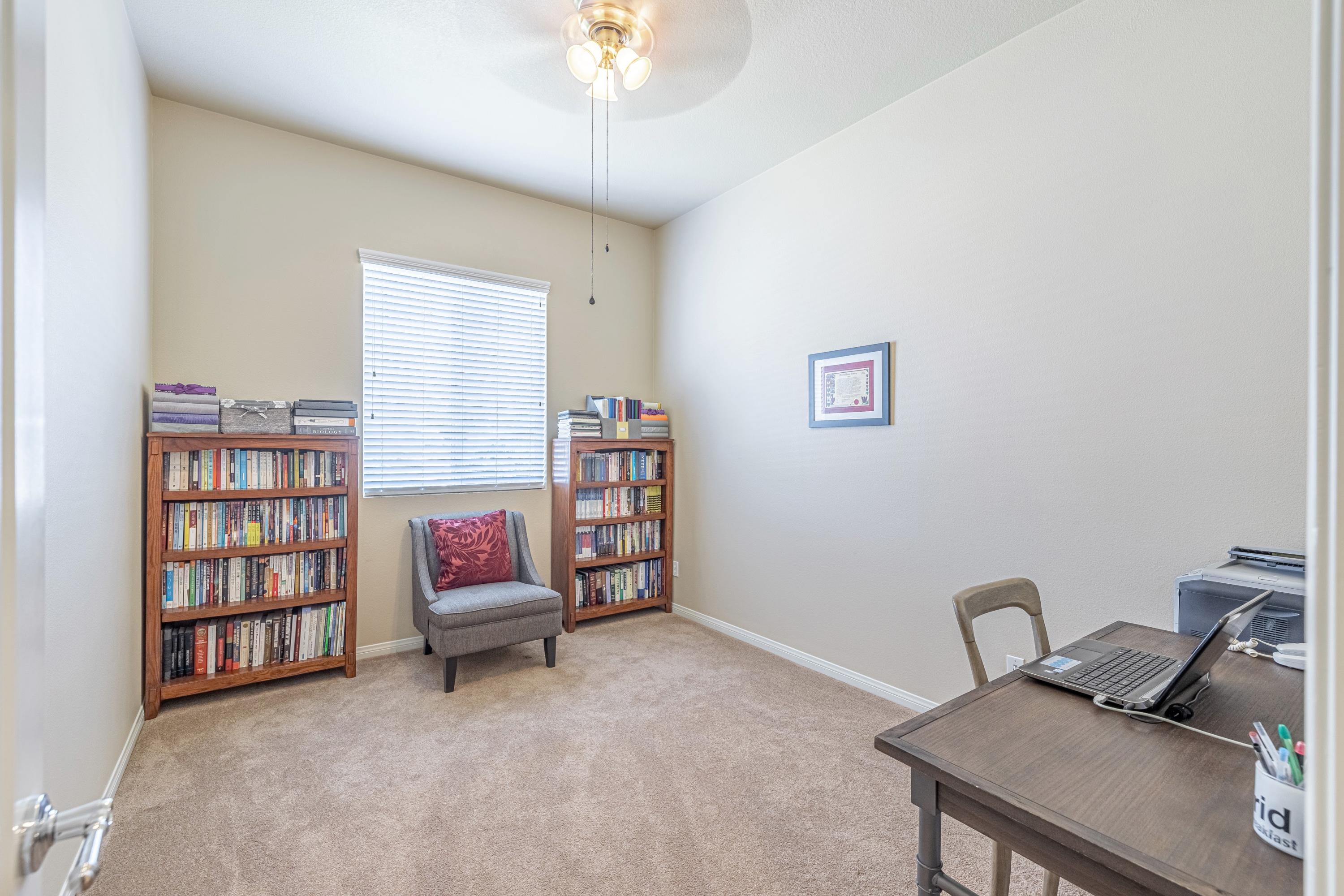 6853 Cabernet Road Palmdale, CA 93551 - Photo 8 of 42 a workspace with a bookshelf