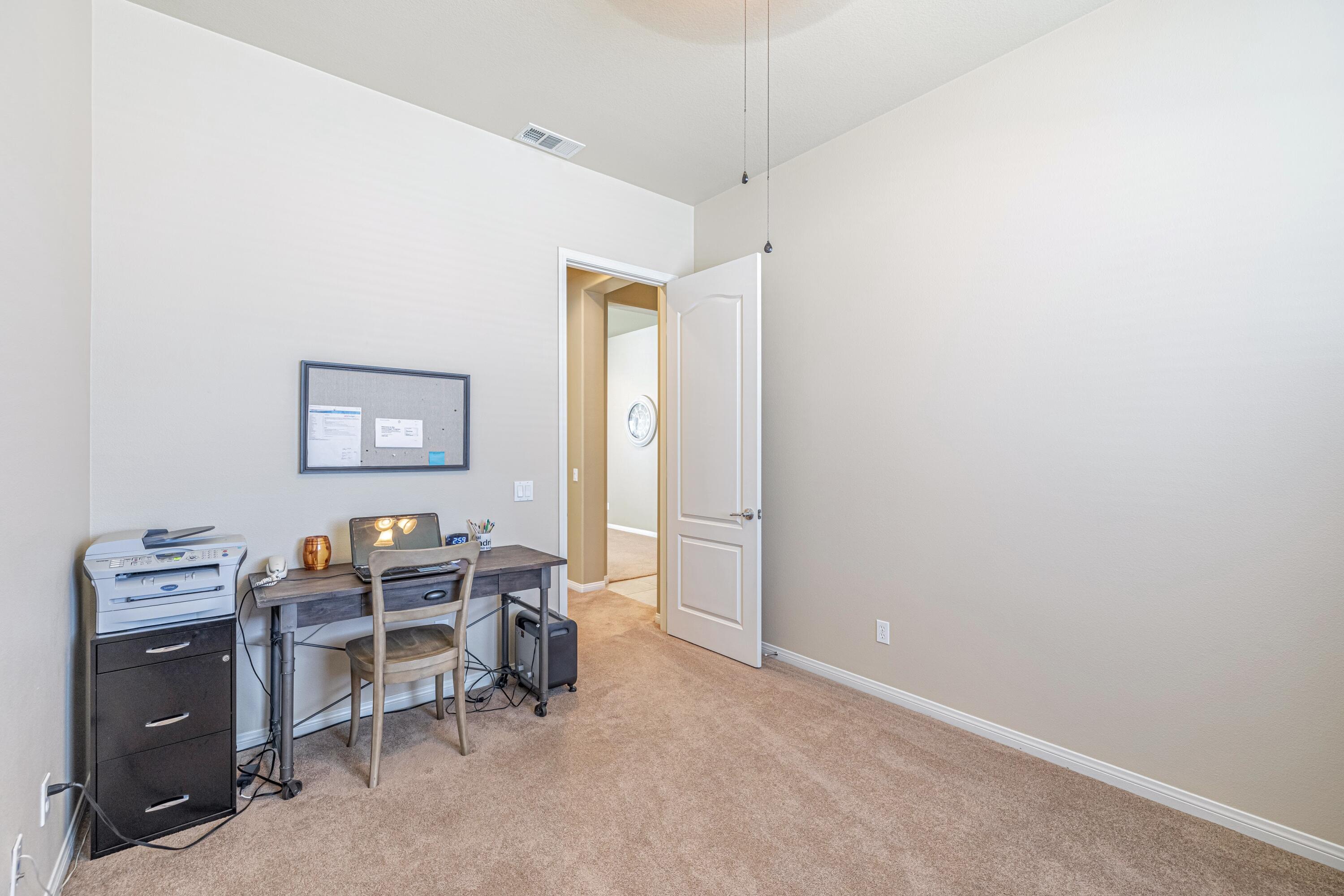 6853 Cabernet Road Palmdale, CA 93551 - Photo 9 of 42 a view of a workspace with furniture