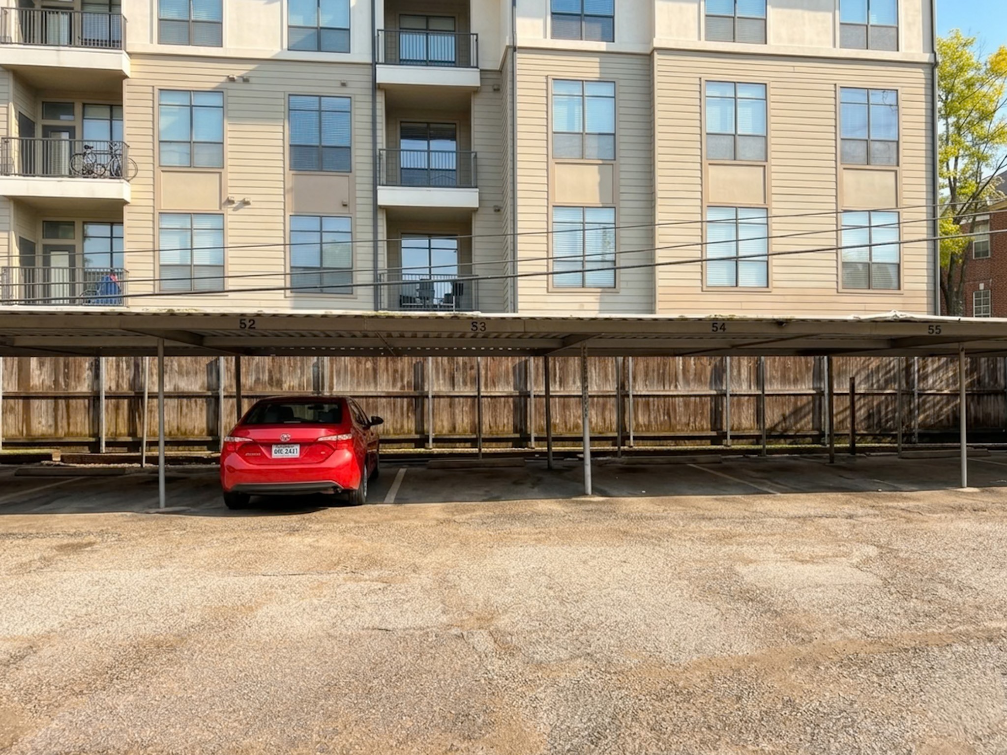2574 Marilee Lane, Unit 23 Houston, TX 77057 - Photo 21 of 22 The condo includes a gated parking area with an assigned covered carport.