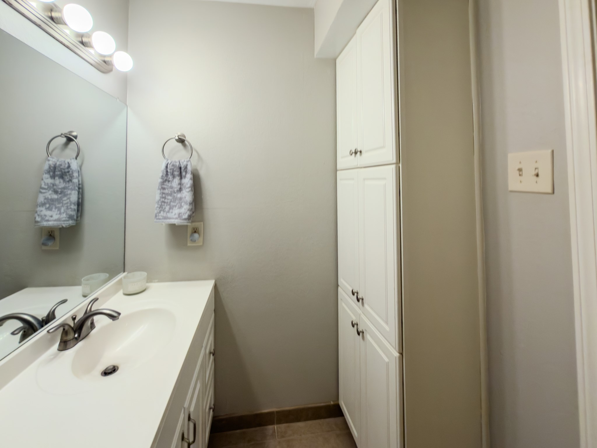 2574 Marilee Lane, Unit 23 Houston, TX 77057 - Photo 8 of 22 The bathroom offers extra built-in cabinetry for additional storage.