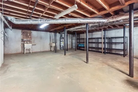 a view of empty room with wooden ceiling