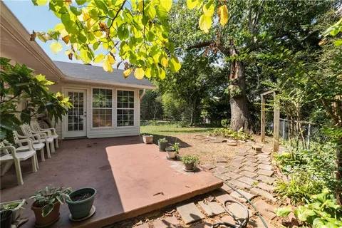 a view of a backyard with sitting area