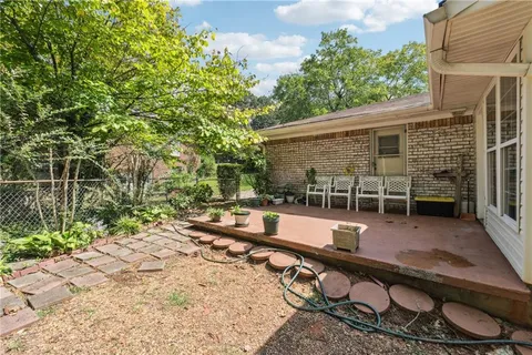 a backyard of a house with barbeque oven