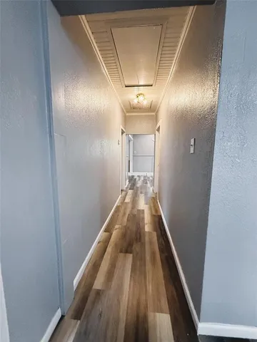a view of kitchen and dining room with wooden floor