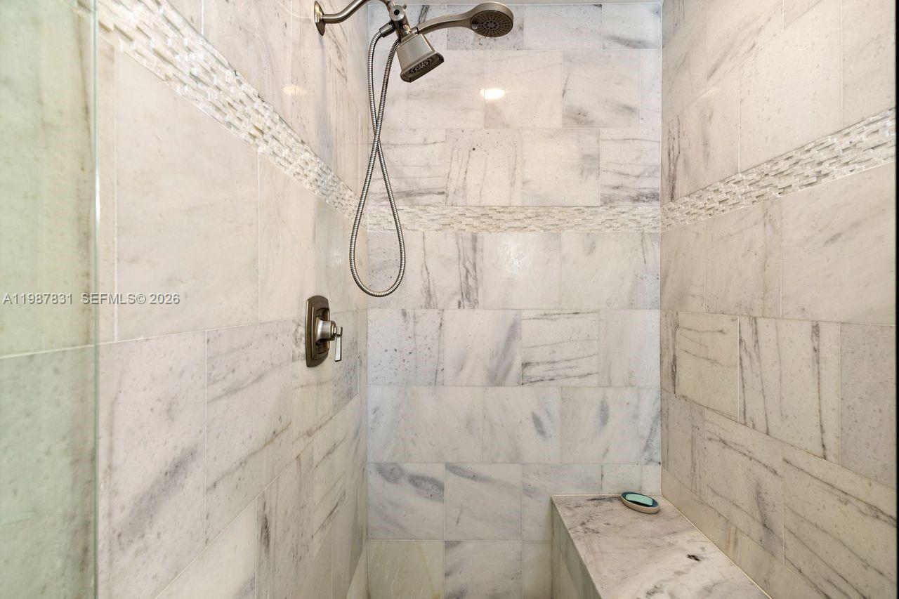 18551 Woodstream Drive Boca Raton, FL 33498 - Photo 21 of 27 a bathroom with a shower