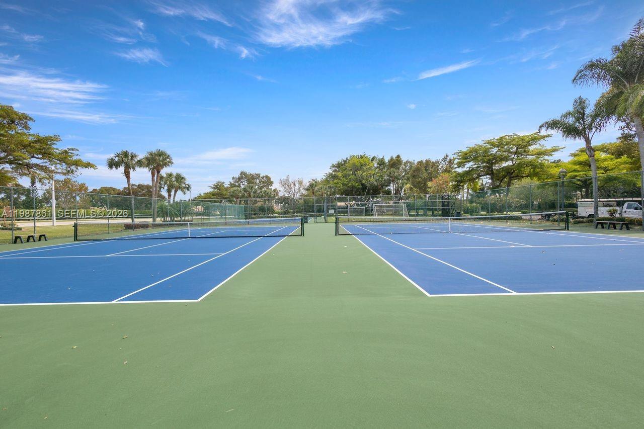18551 Woodstream Drive Boca Raton, FL 33498 - Photo 22 of 27 a tennis court view