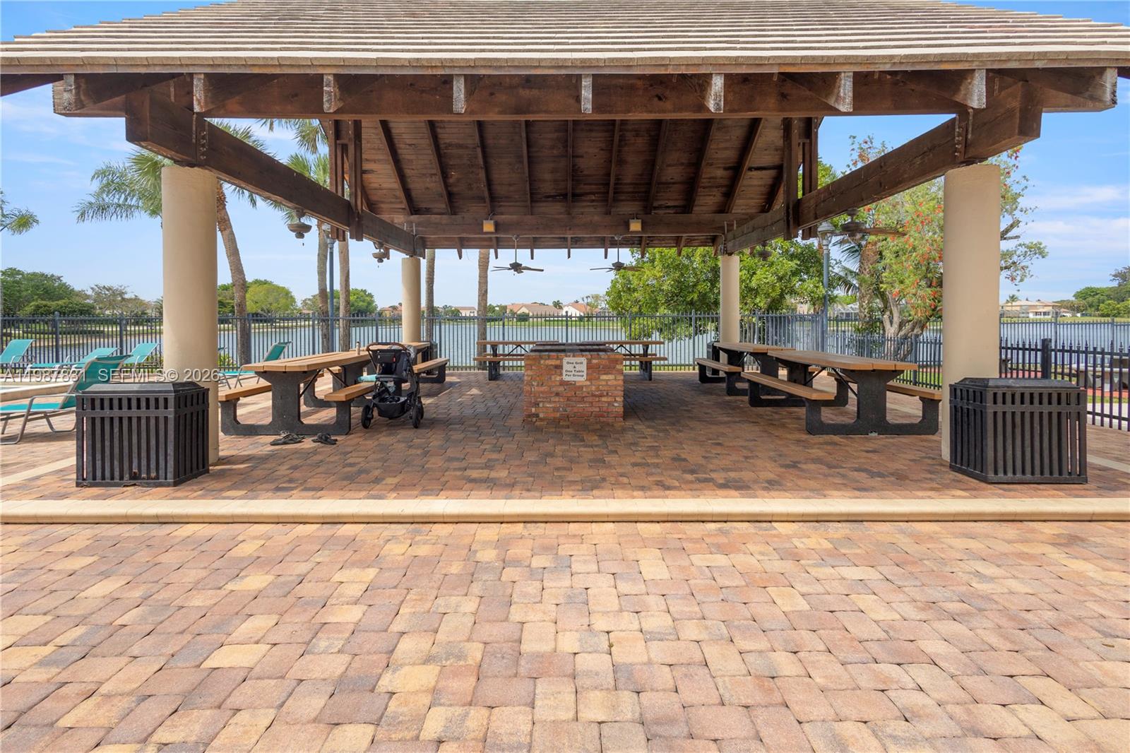 18551 Woodstream Drive Boca Raton, FL 33498 - Photo 24 of 27 a view of living room with patio furniture and a terrace