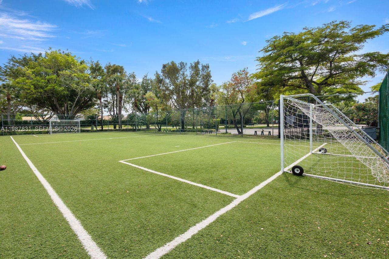 18551 Woodstream Drive Boca Raton, FL 33498 - Photo 26 of 27 a view of a tennis court