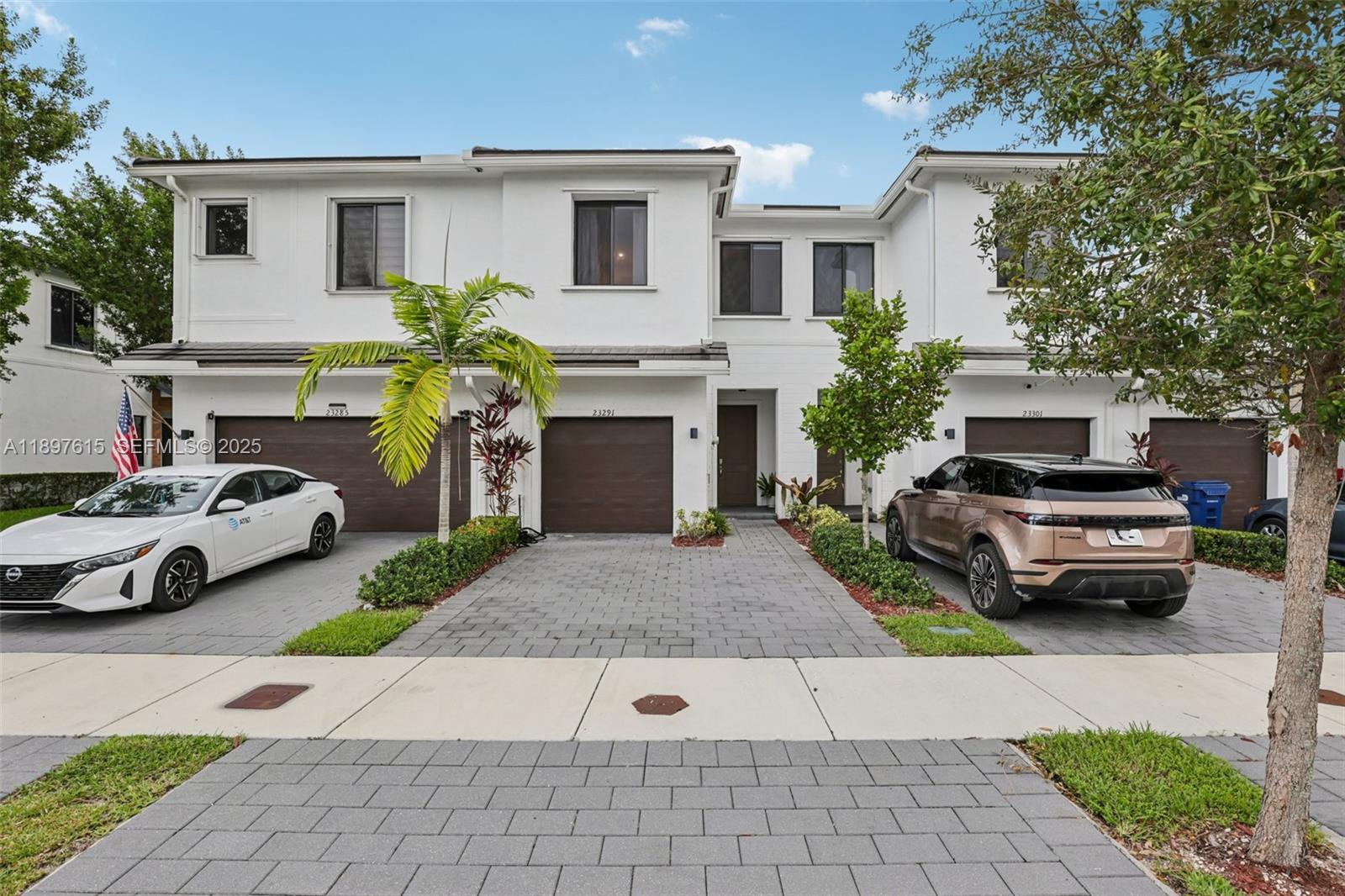 23291 Southwest 110th Court Homestead, FL 33032 - Photo 1 of 41 a car parked in front of white house