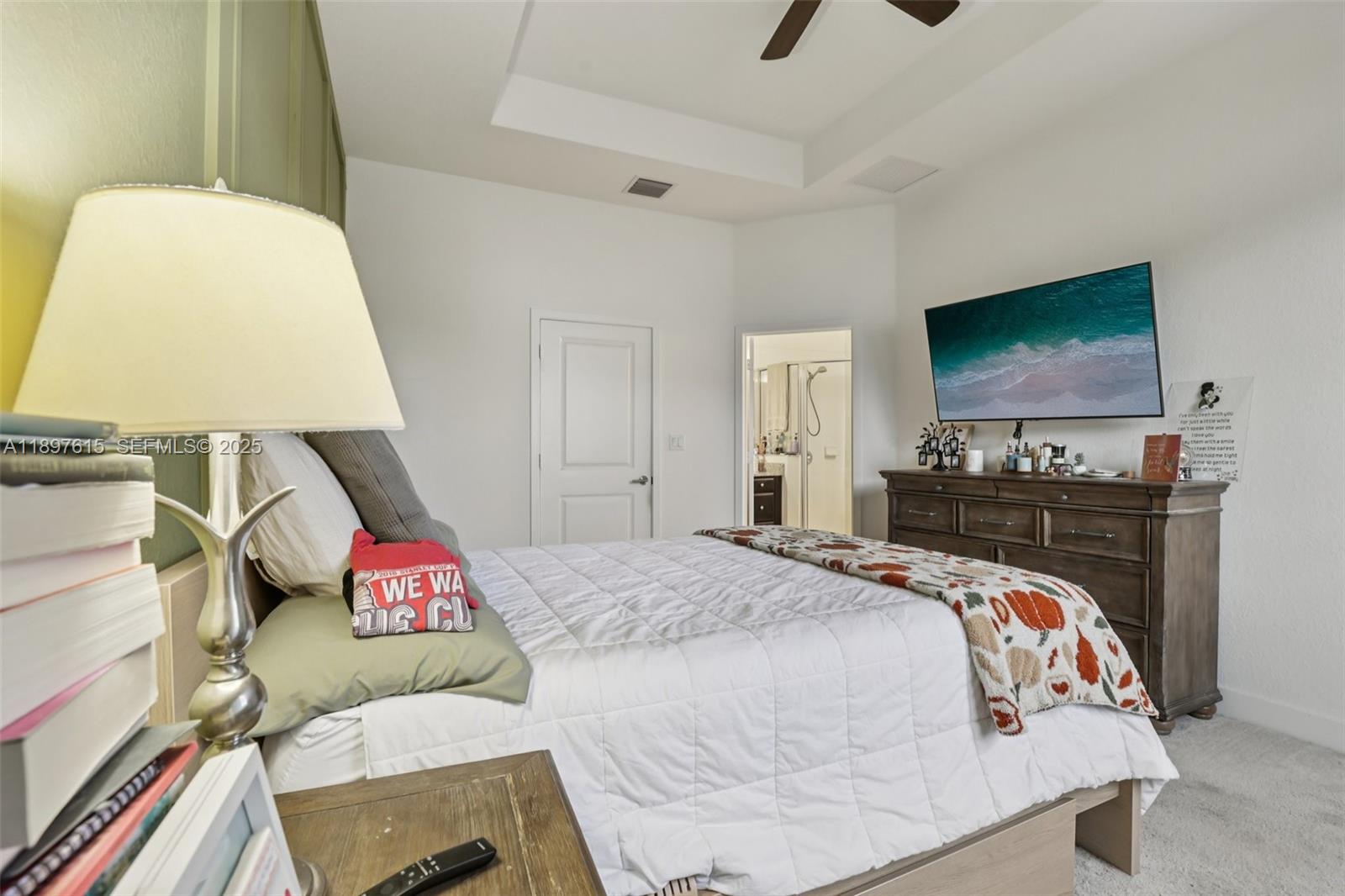 23291 Southwest 110th Court Homestead, FL 33032 - Photo 18 of 41 a bedroom with a bed and a flat screen tv