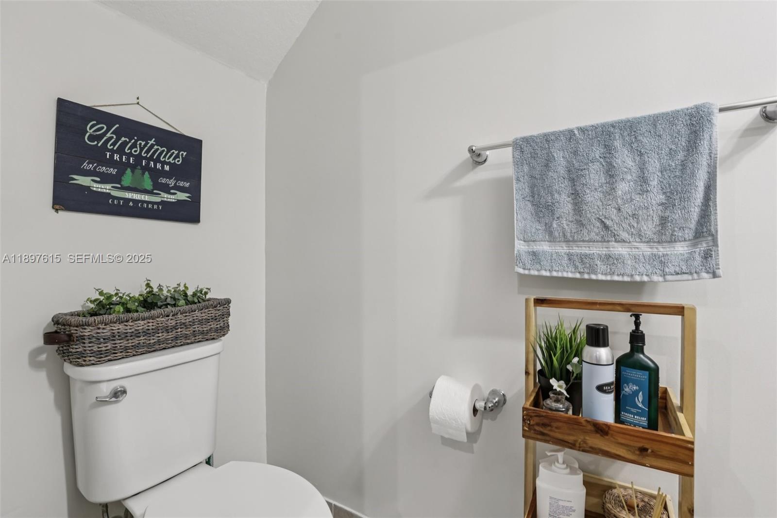 23291 Southwest 110th Court Homestead, FL 33032 - Photo 26 of 41 a bathroom with a toilet a sink and mirror