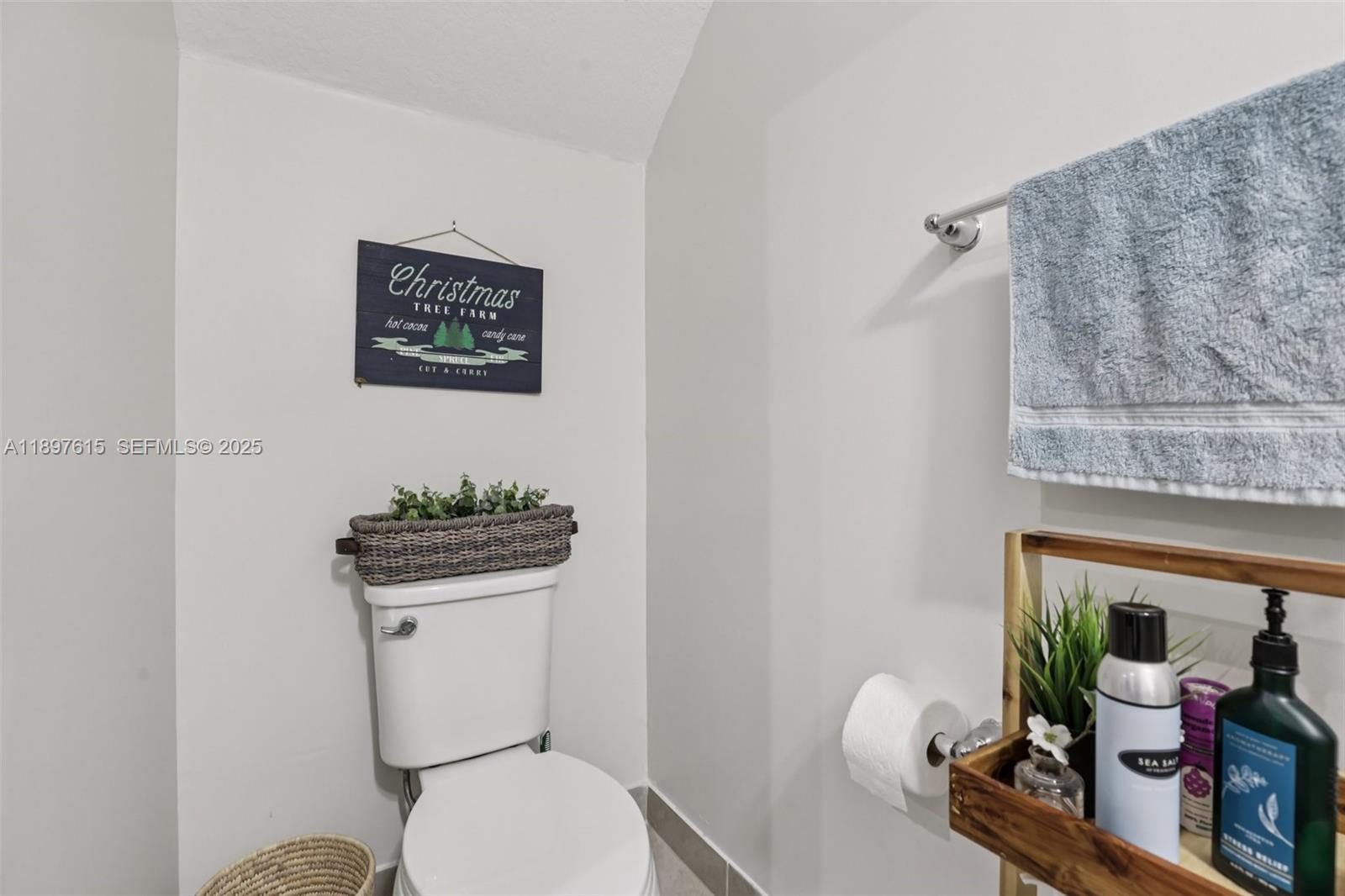 23291 Southwest 110th Court Homestead, FL 33032 - Photo 27 of 41 a white toilet sitting next to a bathroom sink