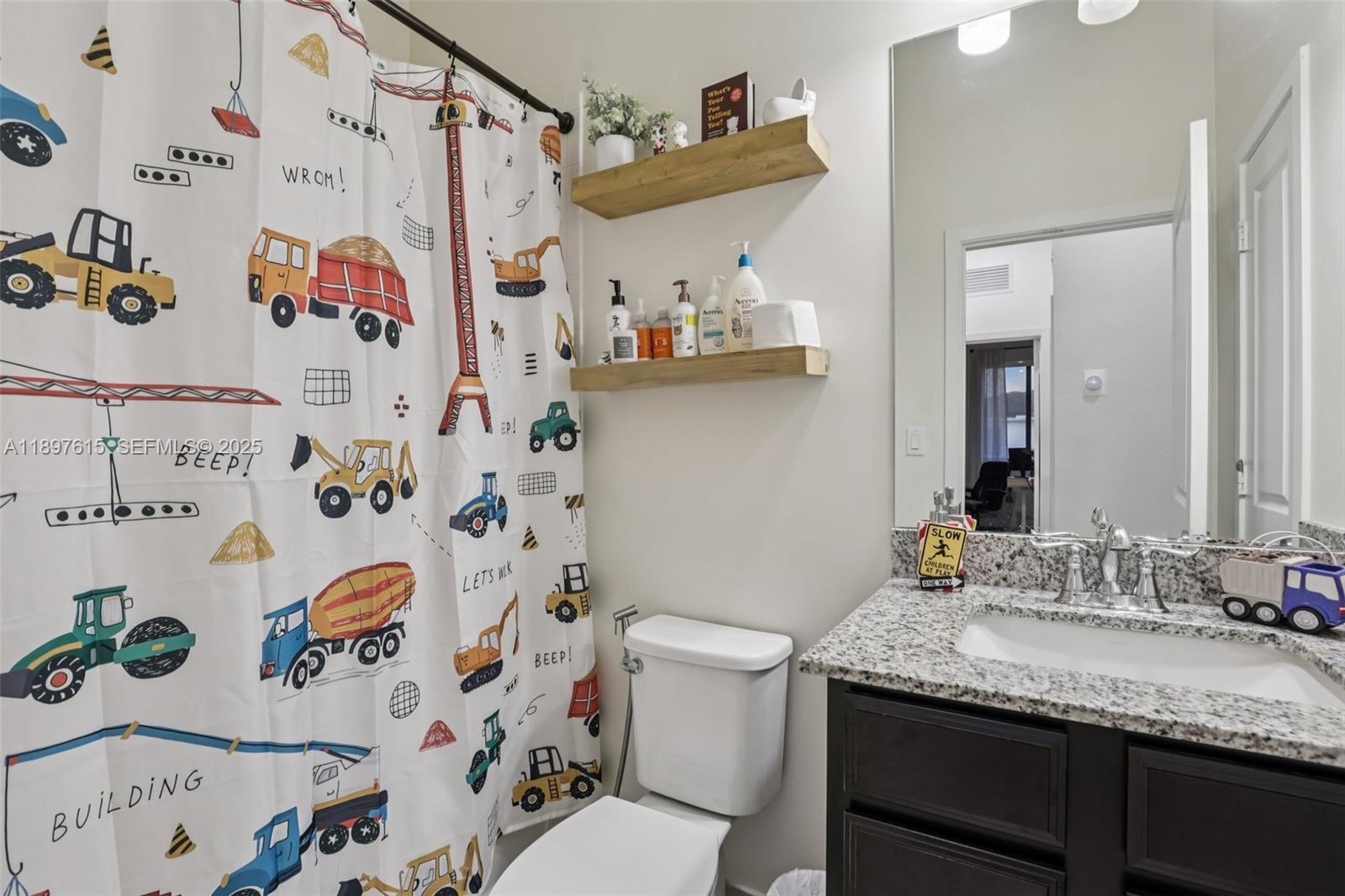 23291 Southwest 110th Court Homestead, FL 33032 - Photo 29 of 41 a bathroom with a granite countertop sink and a mirror