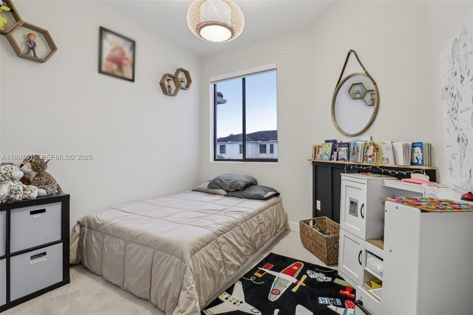 23291 Southwest 110th Court Homestead, FL 33032 - Photo 31 of 41 a bedroom with a bed a mirror and a table