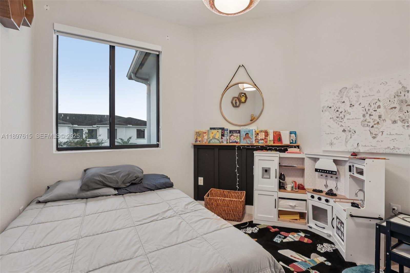 23291 Southwest 110th Court Homestead, FL 33032 - Photo 32 of 41 a bedroom with a bed and a window