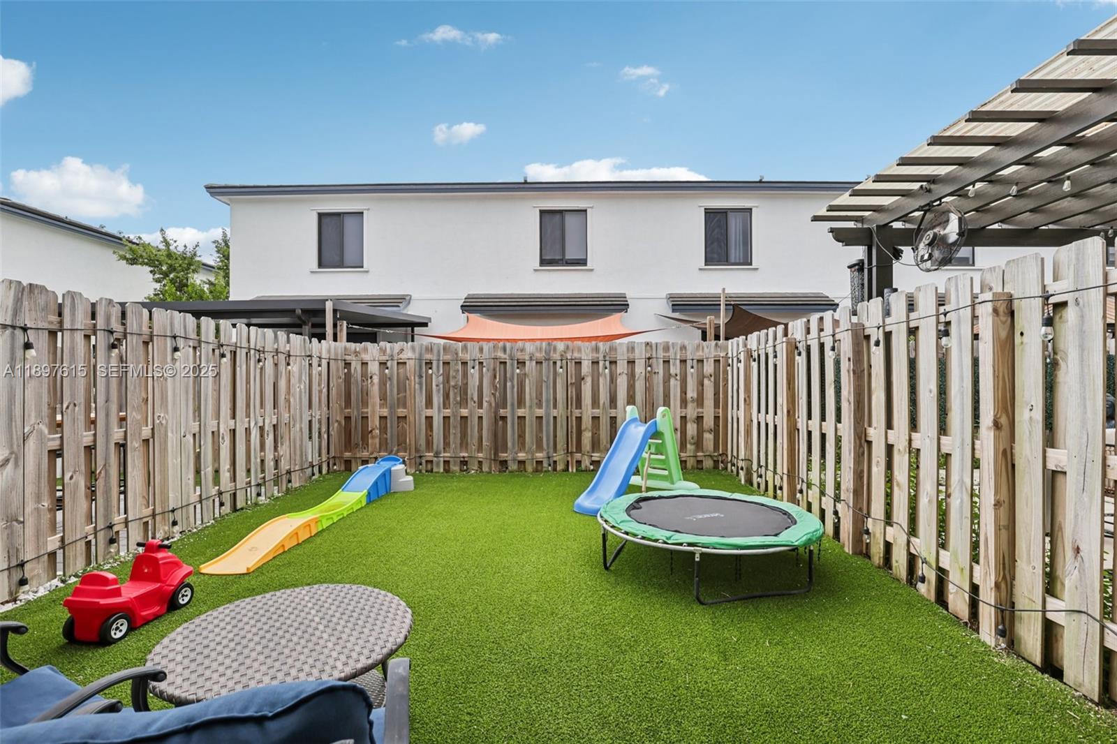 23291 Southwest 110th Court Homestead, FL 33032 - Photo 38 of 41 a view of a table and chairs in patio