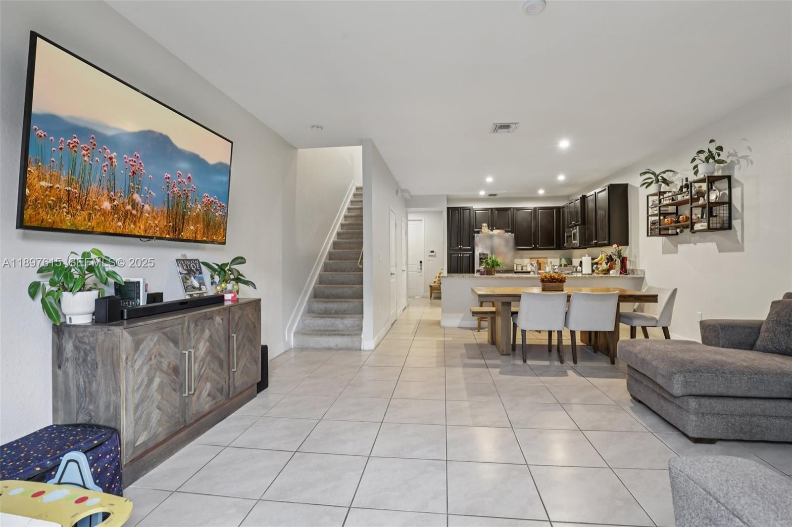 23291 Southwest 110th Court Homestead, FL 33032 - Photo 4 of 41 a living room with furniture and a flat screen tv