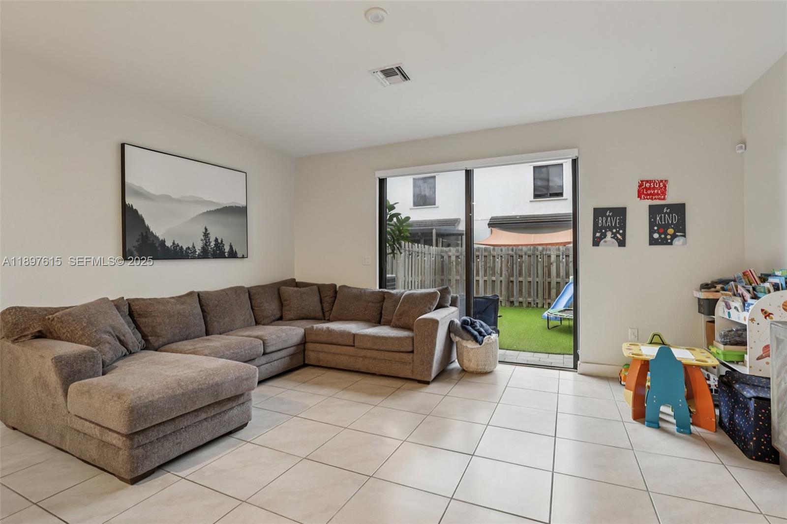 23291 Southwest 110th Court Homestead, FL 33032 - Photo 5 of 41 a living room with furniture and a couch