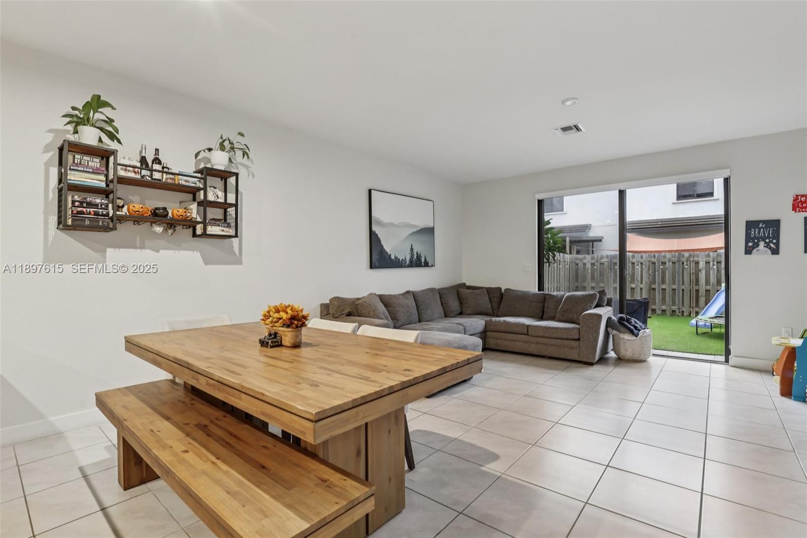 23291 Southwest 110th Court Homestead, FL 33032 - Photo 9 of 41 a living room with furniture and next to a window