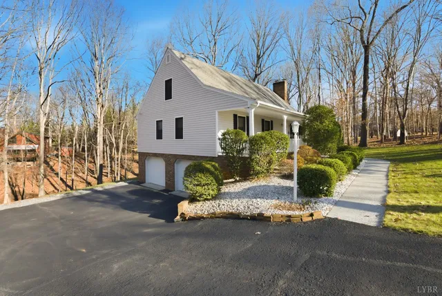 a front view of a house with a yard garage and outdoor seating