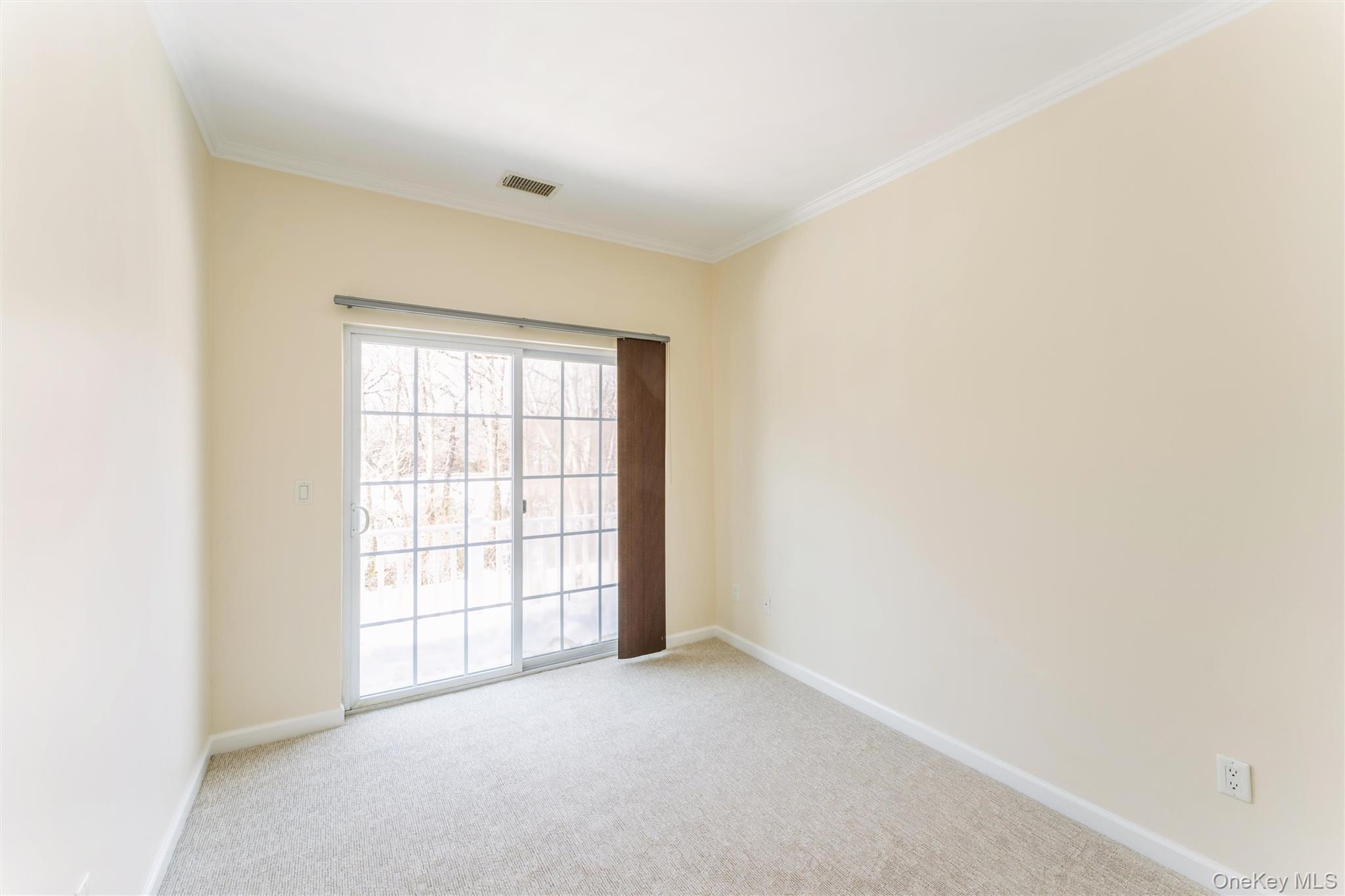 169 Spring Drive East Meadow, NY 11554 - Photo 13 of 33 an empty room with windows