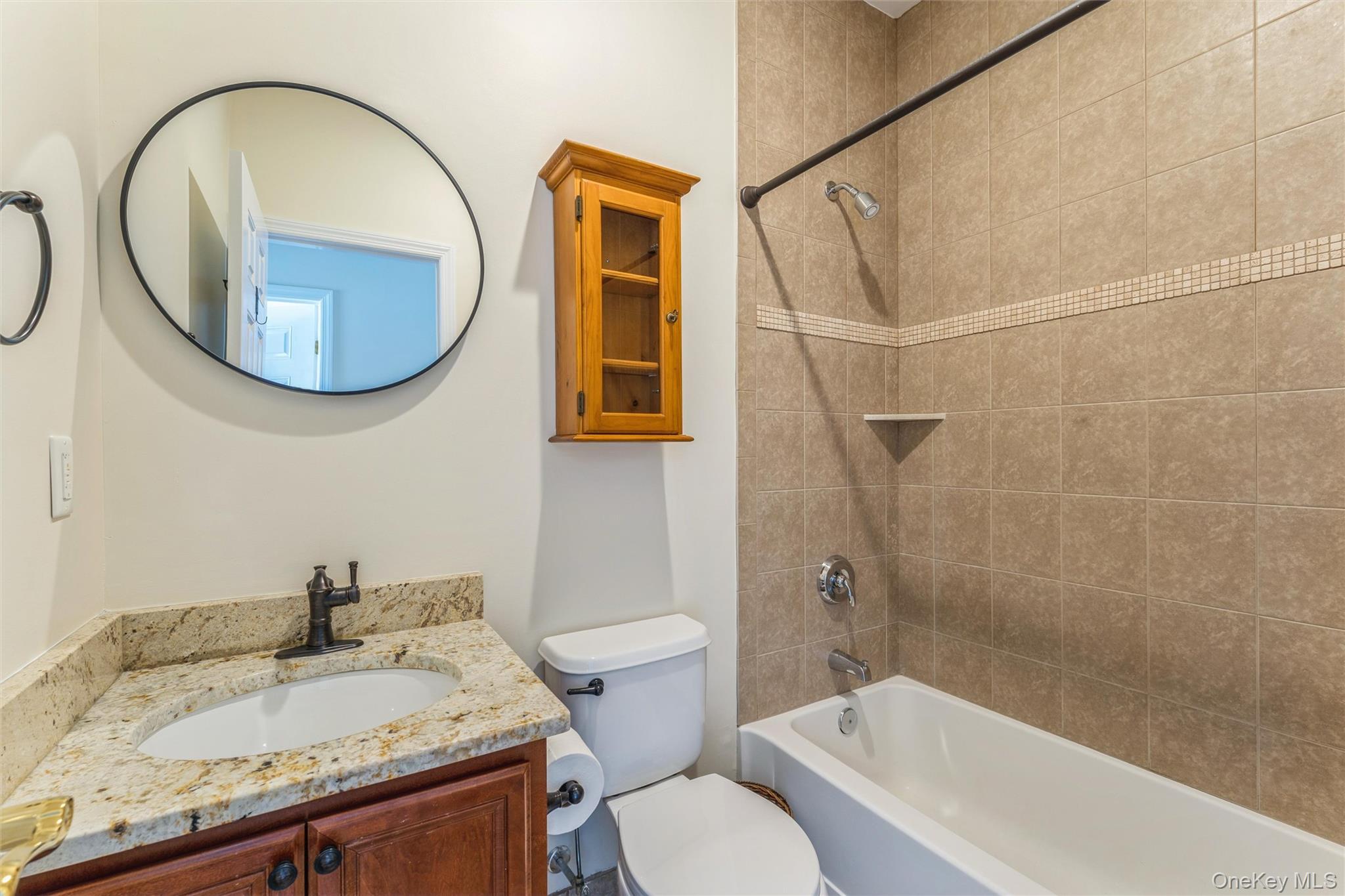 169 Spring Drive East Meadow, NY 11554 - Photo 14 of 33 a bathroom with a sink and a mirror