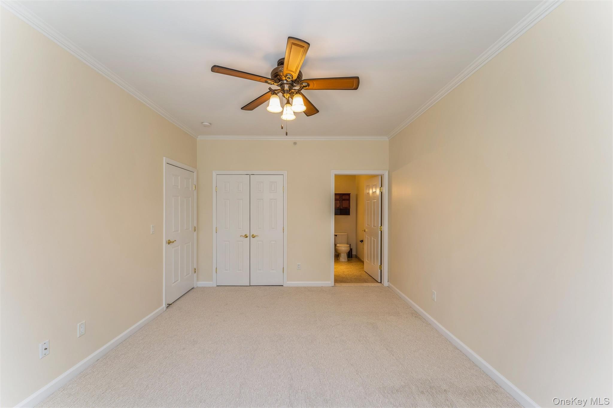 169 Spring Drive East Meadow, NY 11554 - Photo 16 of 33 a view of a livingroom with a ceiling fan and window