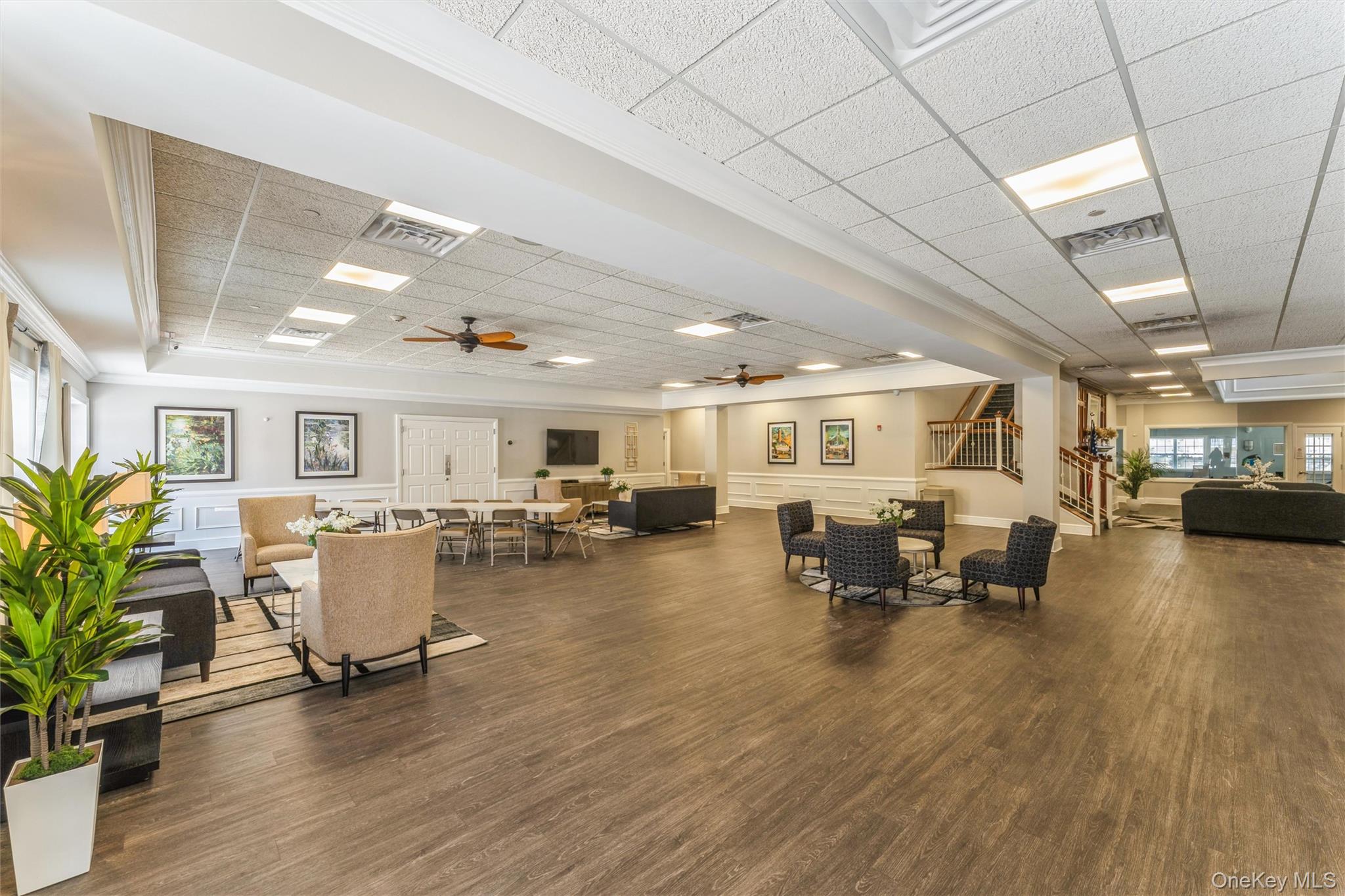 169 Spring Drive East Meadow, NY 11554 - Photo 21 of 33 a living room with furniture and a wooden floor