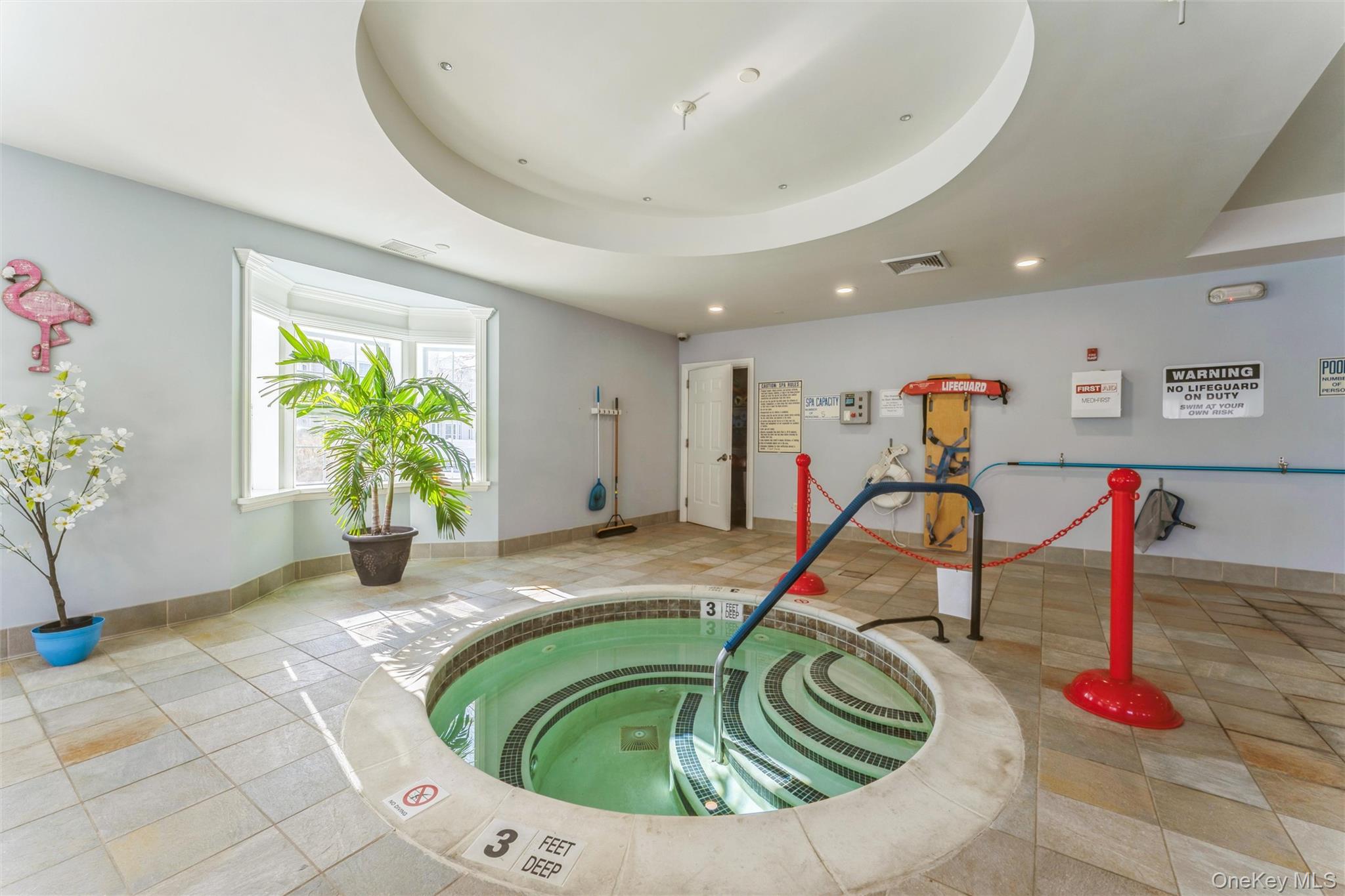 169 Spring Drive East Meadow, NY 11554 - Photo 30 of 33 a view of a room with gym equipment