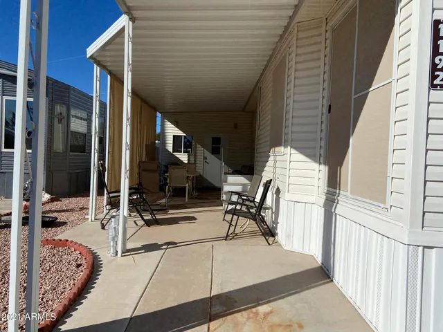 a view of a balcony with chairs