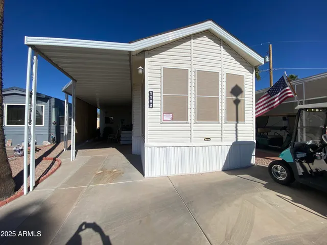 a front view of a house with parking area