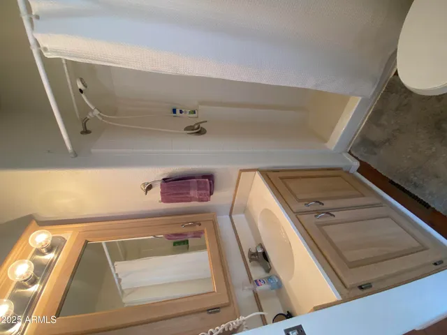 a view of washer and dryer with wooden floor