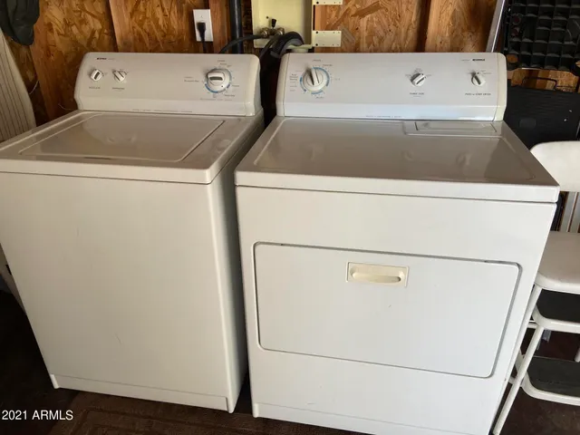 with utility room with dryer and washer