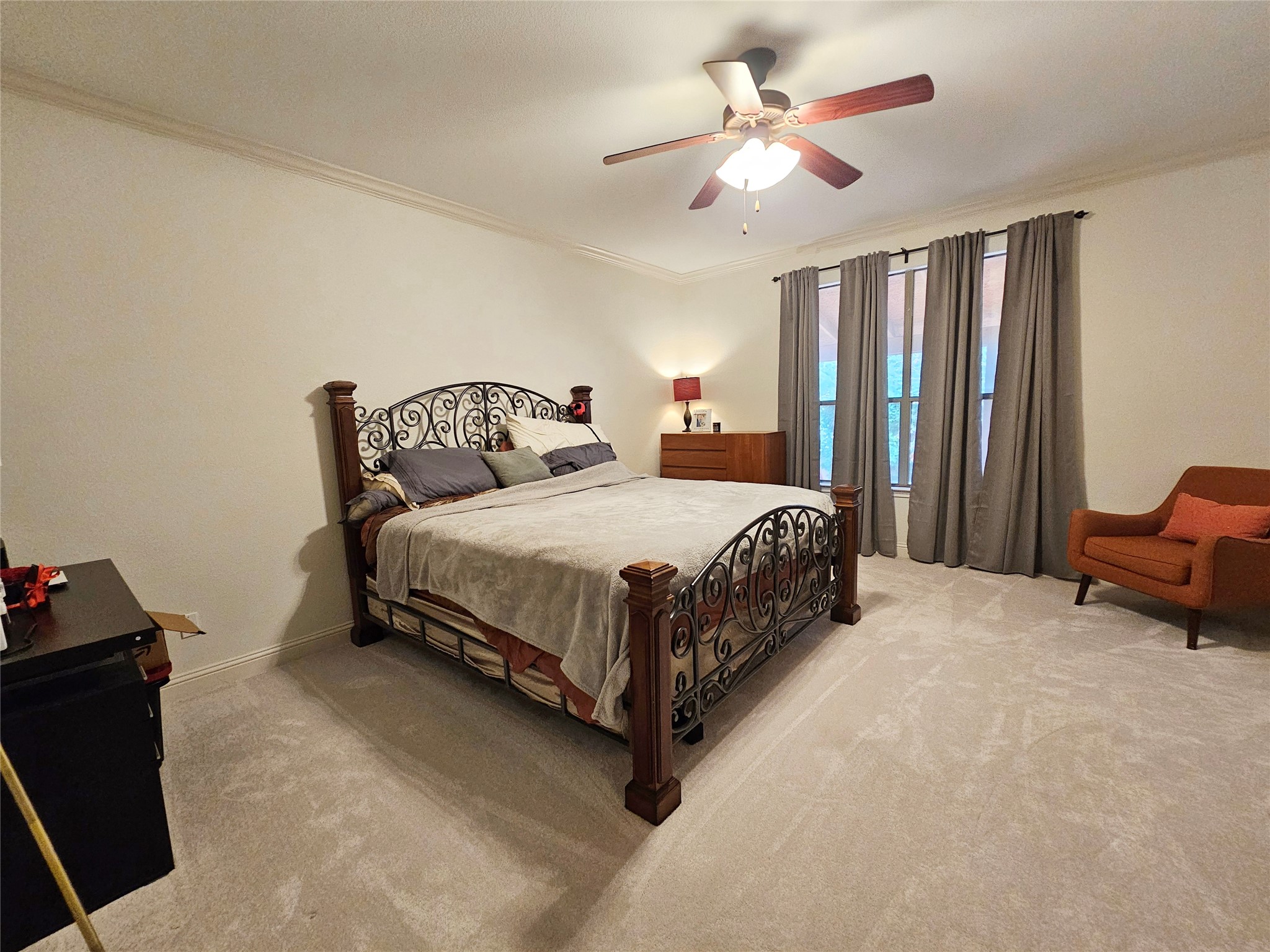11508 Flushwing Drive Austin, TX 78754 - Photo 12 of 24 Bedroom featuring ornamental molding, light colored carpet, and a ceiling fan
